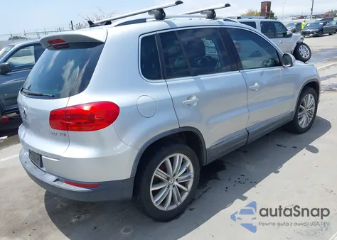 2014 Volkswagen Tiguan Sel z USA, uszkodzony, nr VIN WVGAV3AX2EW557480
